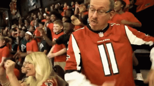 Man In Falcons Jersey Stands In Crowd GIF