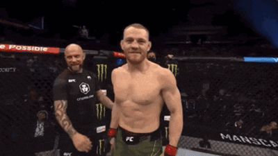 Man In FC Belt Standing In Front Of Man In Black Shirt GIF