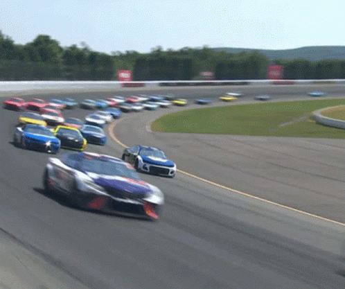 Man in FedEx Hat on Microphone Martinsville Sign