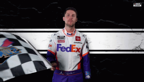 Man in Fedex Uniform Holding Checkered Flag