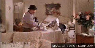 Man In Fedora At Messy Table GIF