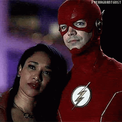 Man in Flash Suit Next to Woman
