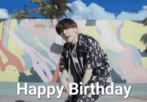 Man in Floral Shirt Dancing in Front of Happy Birthday Mural