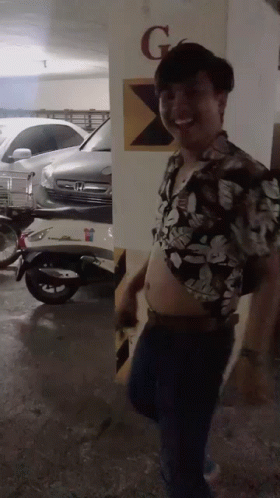 Man in Floral Shirt in Parking Garage