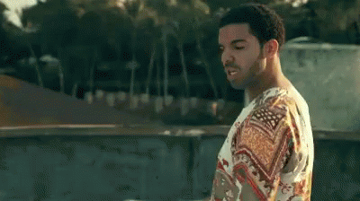 Man In Floral Shirt On Rooftop GIF