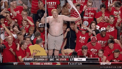 Man in Florida State Shirt Holding Bat in Crowd
