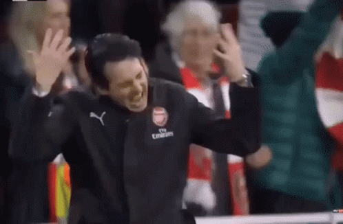 Man in Fly Emirates Jacket Before Crowd