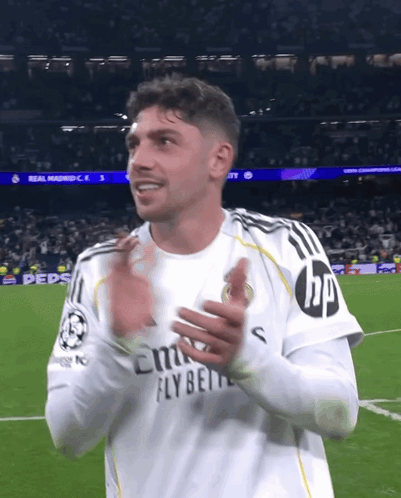 Man in Fly Emirates Shirt Clapping