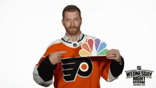 Man in Flyers Jersey Holding NBC Sign