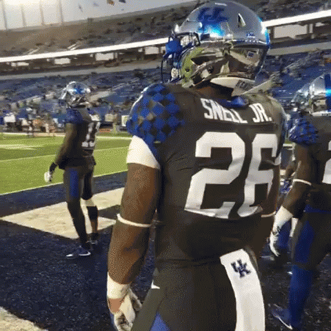 Man in Football Uniform Number 6