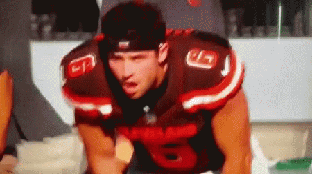 Man in Football Uniform Number 8