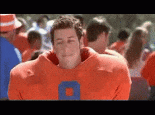 Man in Football Uniform Number 8