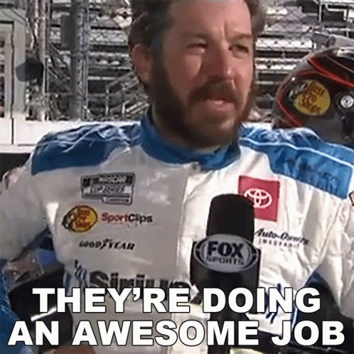 Man in Fox Sports Jacket Talking Into Microphone