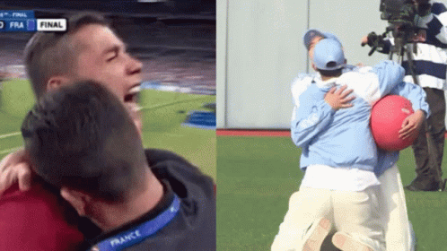 Man in France Lanyard Hugging Another on Soccer Field
