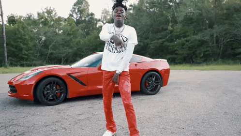 Man In Freedom T-Shirt Near Red Car GIF