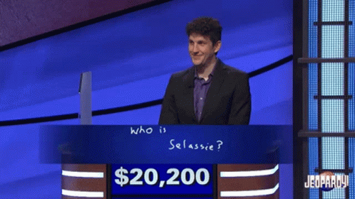 Man In Front Of $20,200 Jeopardy Sign GIF