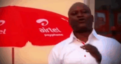 Man In Front Of Airtel Umbrella GIF