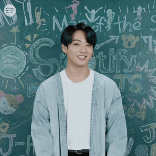 Man in Front of Blackboard Saying Spotify