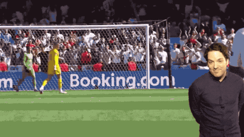 Man in Front of Booking.com Ad