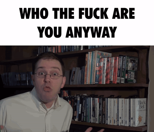 Man in Front of Bookshelf Who the Fuck Are You Anyway
