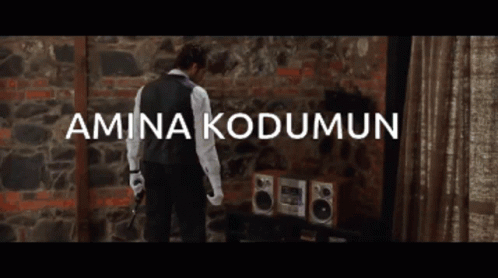 Man in Front of Brick Wall Amina Kodumun