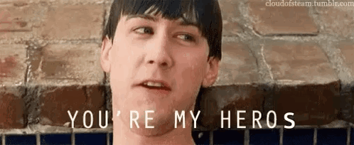 Man In Front Of Brick Wall Saying You're My Heros GIF