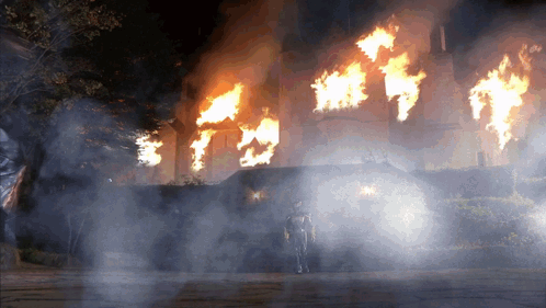 Man in Front of Burning Building
