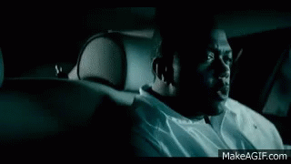 Man In Front Of Car With Lights On GIF