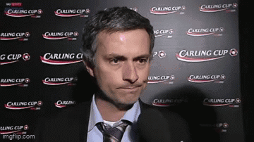 Man in Front of Carling Cup Wall