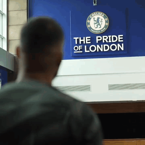 Man in Front of Chelsea FC Sign