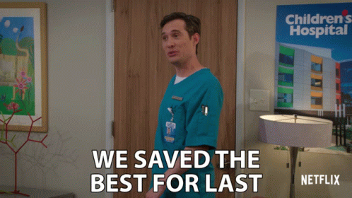 Man In Front Of Children's Hospital Sign GIF