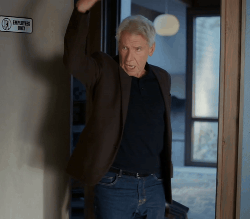 Man In Front Of Employees Only Sign GIF