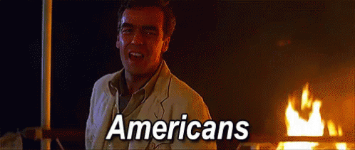 Man in Front of Fire With Americans