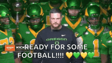 Man in Front of Football Players Saying Kick Ready for Some Football