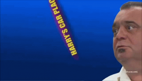 Man In Front Of Harry's Car Place Sign GIF