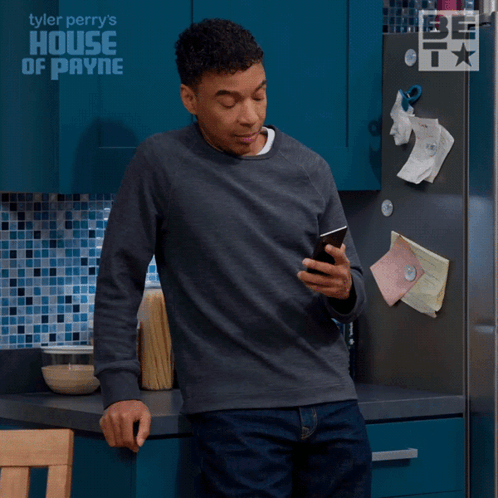 Man in Front of House of Payne Fridge