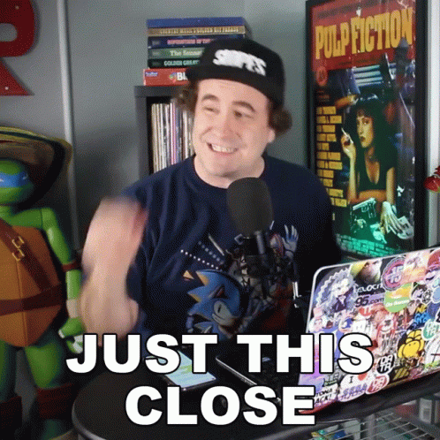 Man In Front Of Laptop Saying Just This Close GIF