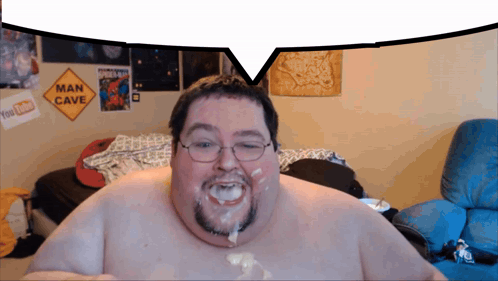 Man in Front of Man Cave Sign