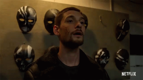 Man in Front of Mask Wall with Netflix