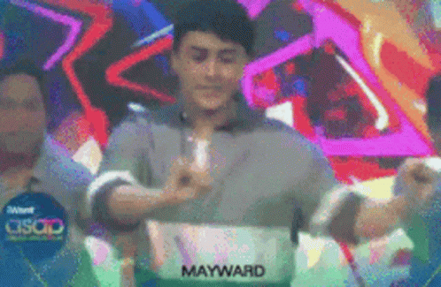 Man in Front of Mayward Sign