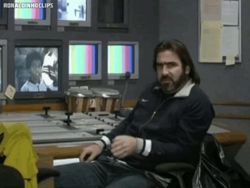 Man in Front of Monitors With Ronaldinho Clips