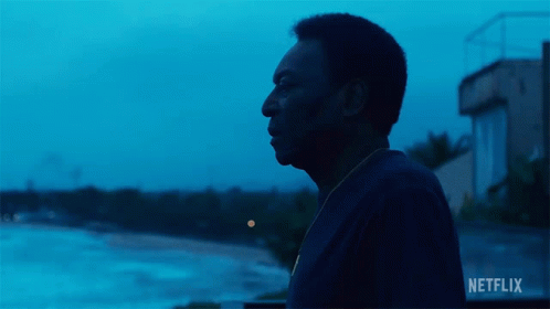 Man In Front Of Netflix Sign GIF