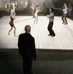 Man in Front of People Dancing on Stage