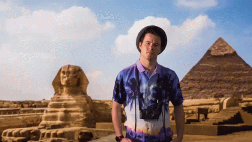 Man in Front of Pyramid and Statue