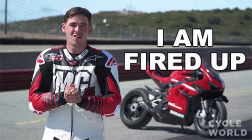 Man in Front of Red Ducati Saying I Am Fired Up
