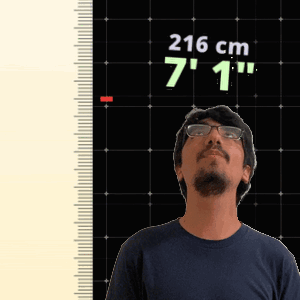 Man in Front of Ruler Saying 216 cm