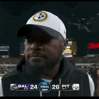 Man in Front of Scoreboard Saying Bal 24