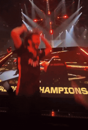 Man In Front Of Screen Saying Champions GIF