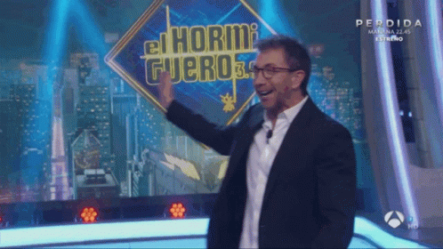 Man in Front of Sign Saying El Hormi Fuero