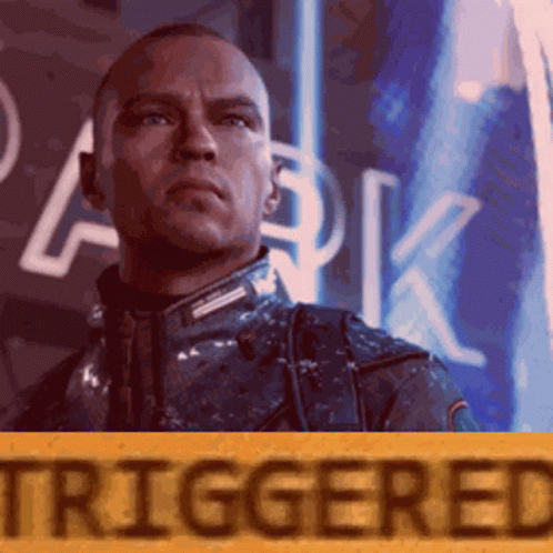 Man in Front of Sign Saying Triggered